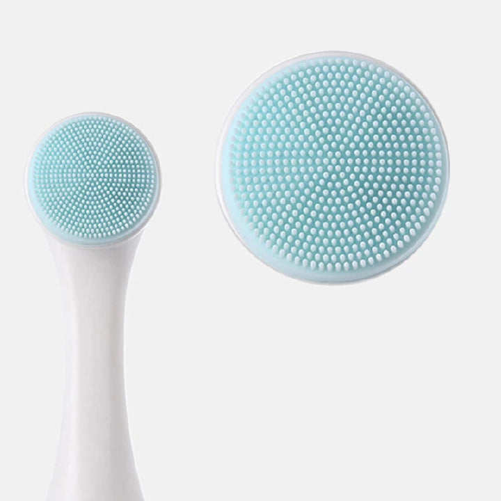 Two silicone face cleaning brushes with blue bristles on a white background